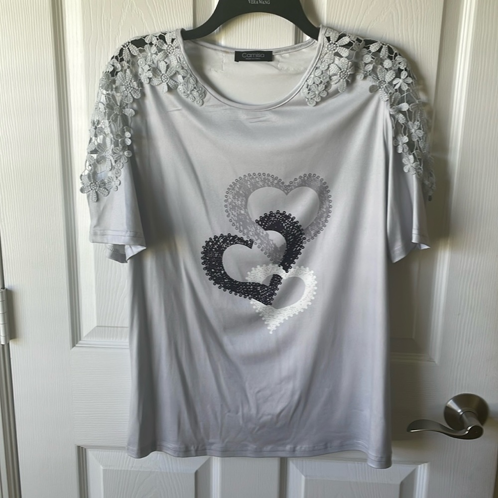 Women’s gray top size large with open trim on sleeves very pretty